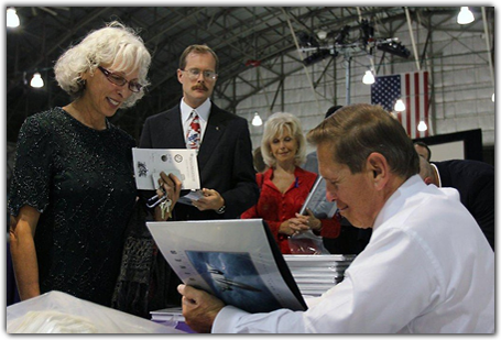 SR-71 pilot Brian Shul autographs copies of his book, 